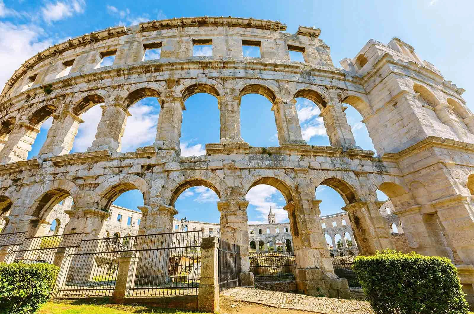 Exterior of an ancient Roman amphitheatre in Pula, Croatia. Concept of English to Croatian translation.