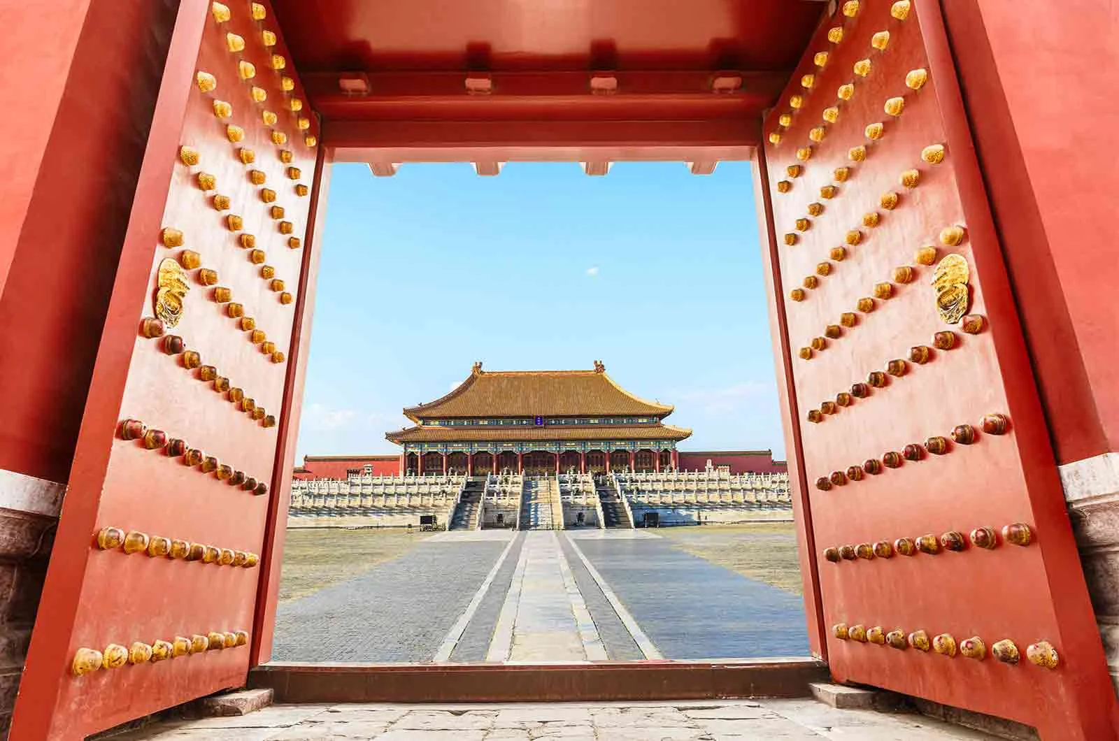 A great red gate of an ancient Chinese palace in Beijing, China. Concept of Chinese translation service.