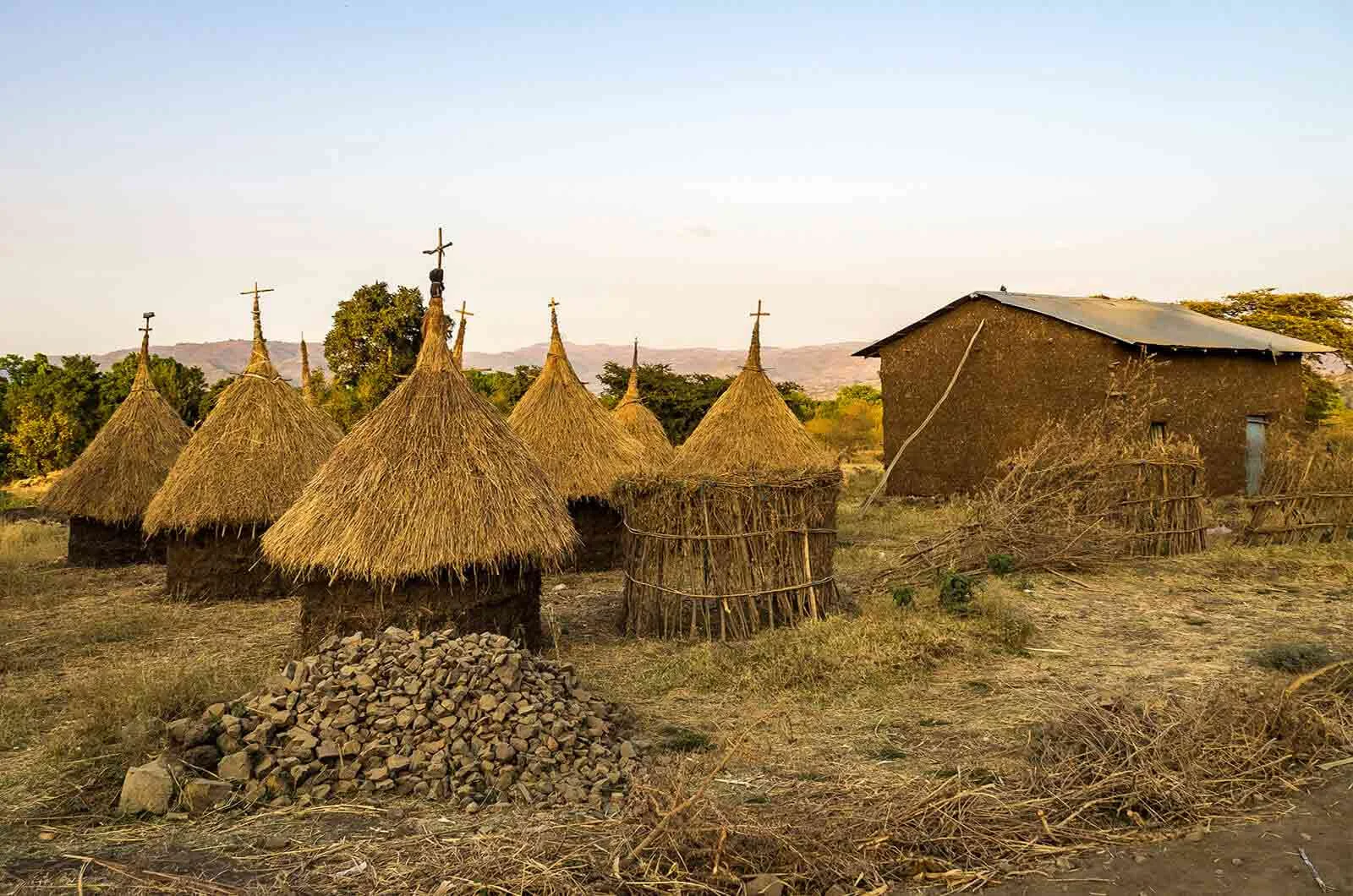 Some thatched houses with piles of stones in Ethiopia, Africa. Concept of the Amharic language of Ethiopia.