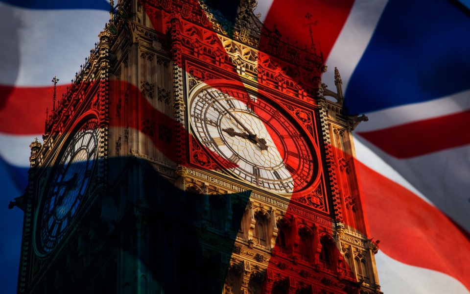 The UK's Union Jack flag and the famous Big Ben at the Westminster Palace in London. Translation services companies in London. 