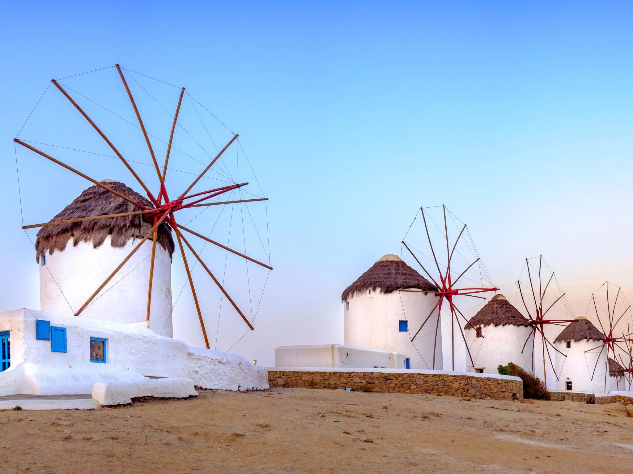 Panoramic view of Greek windmills in the island of Mykonos in Greece. Concept of Greek language, speaking Greek and learning Greek alphabet.