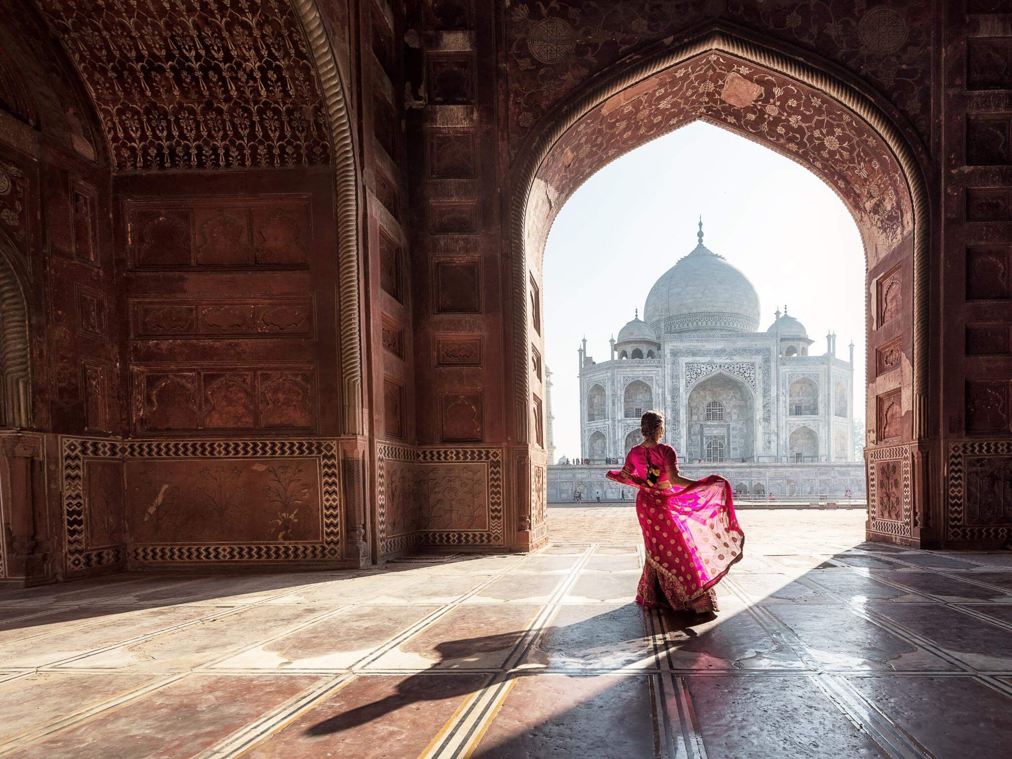 A view of Taj Mahal tomb with a blue sky in Agra, Uttar Pradesh, India. Concept of learning and writing the Hindi language in India.