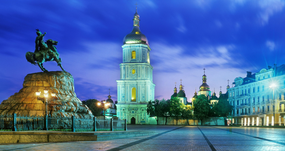 Bohdan Khmelnytsky Monument and Bell tower of Saint Sophia's Cathedral at night. Concept of Ukrainian translation services to English by professional Ukrainian translators.