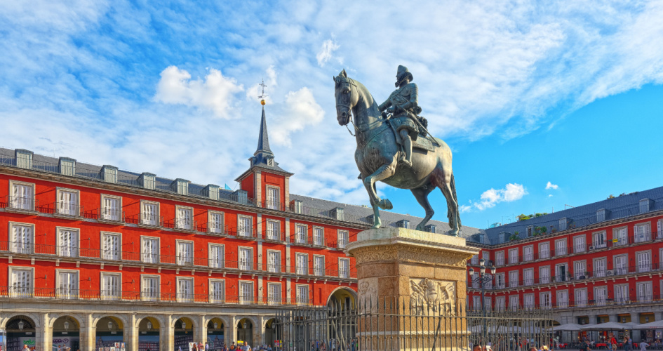 A view of the statue of King Philip III at the center of the square on Plaza Mayor. Concept of English Spanish translation services by professional Spanish translators.