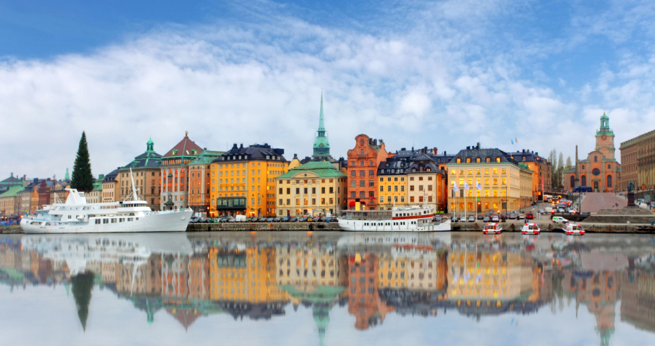 Colourful buildings and boats in Stockholm Harbour. Concept of Swedish translation services by professional Swedish translators.
