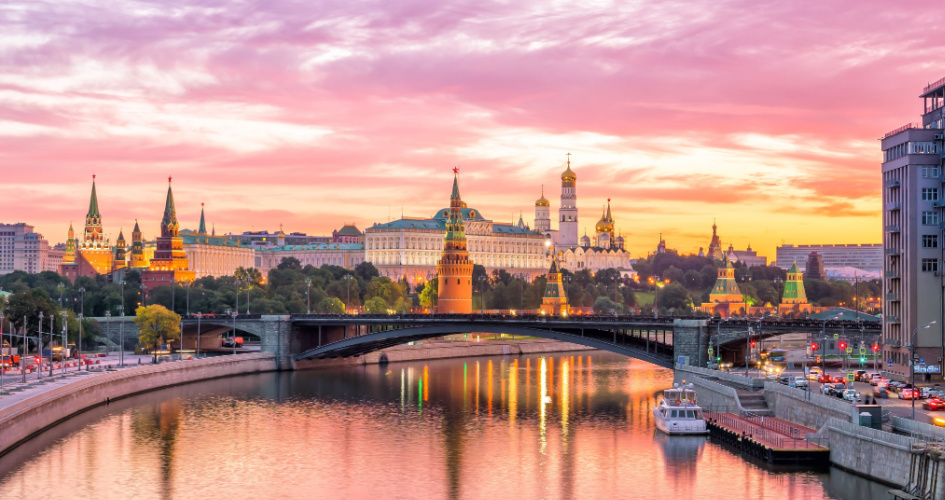 A sunset view of the Moskva river, the Kremlin in the distance. Concept of Russian translation services to English and Russian to English translators.