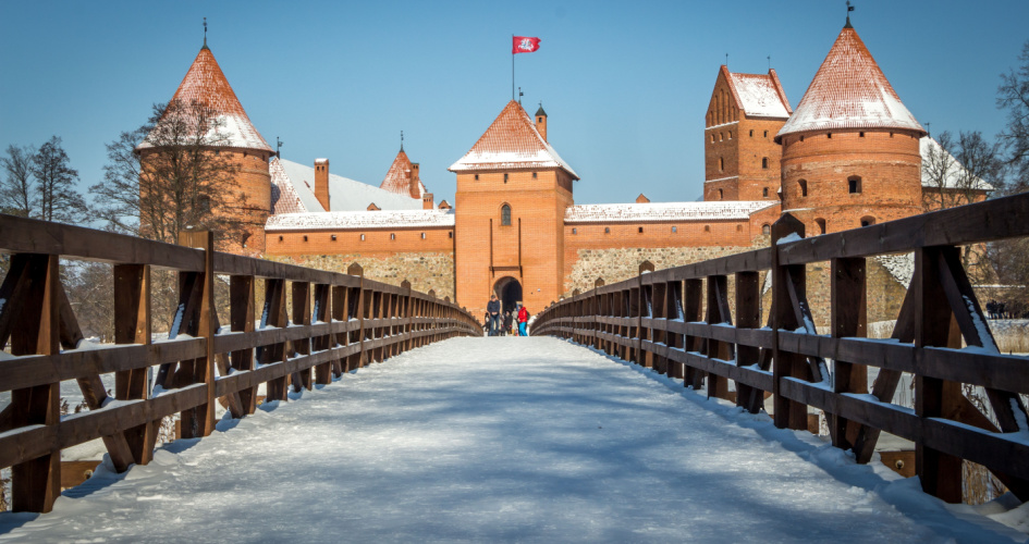 Trakai Island Castle, a 14th century stone castle on an island. Concept of Lithuanian translation services by professional Lithuanian translators.