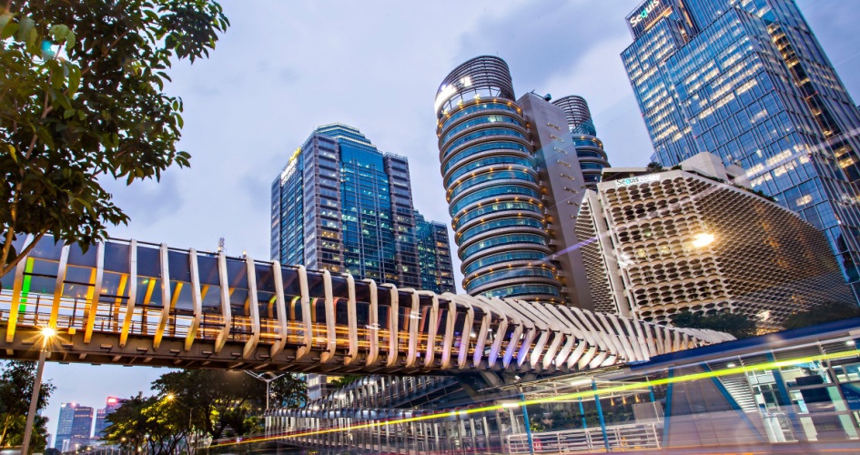 View of modern crossing bridge in the business district of Jakarta. Concept of Bahasa translation services by professional Bahasa translators.