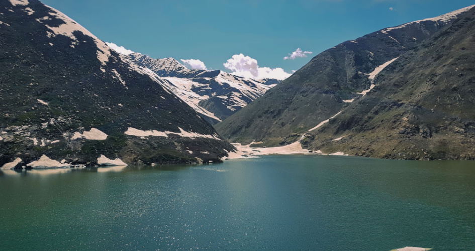 Lulusar Lake and surrounding mountains, Naran, Pakistan. Concept of Pashto translation services.