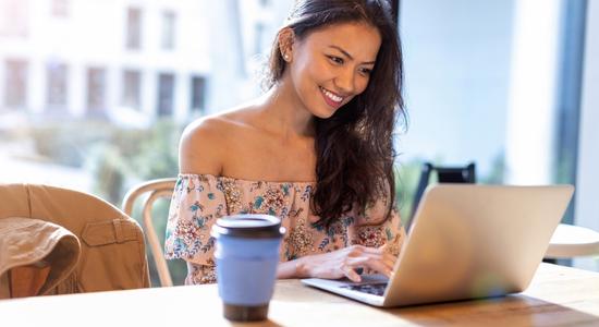 Filipino woman working on table. Concept of professional Filipino translators.