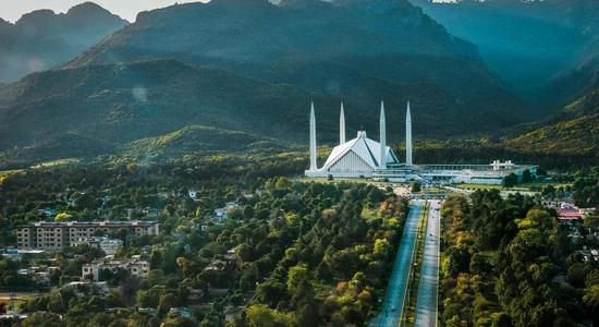 An overhead view of Faisal Mosque and the Margalla Hills in Islamabad.
