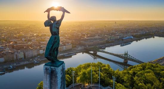 Panoramic view of statue of liberty in Hungary at sunrise.