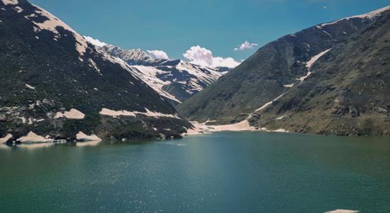 Lulusar Lake and surrounding mountains, Naran, Pakistan. Concept of English to Pashto translation.