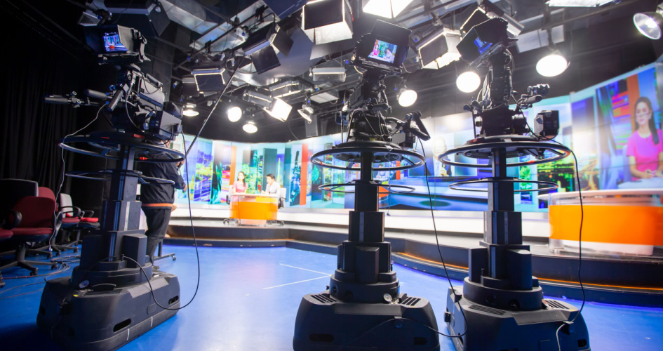 An overhead assembly of lights and cameras in a television studio. Concept of media translations including press release translation, news translation and more.