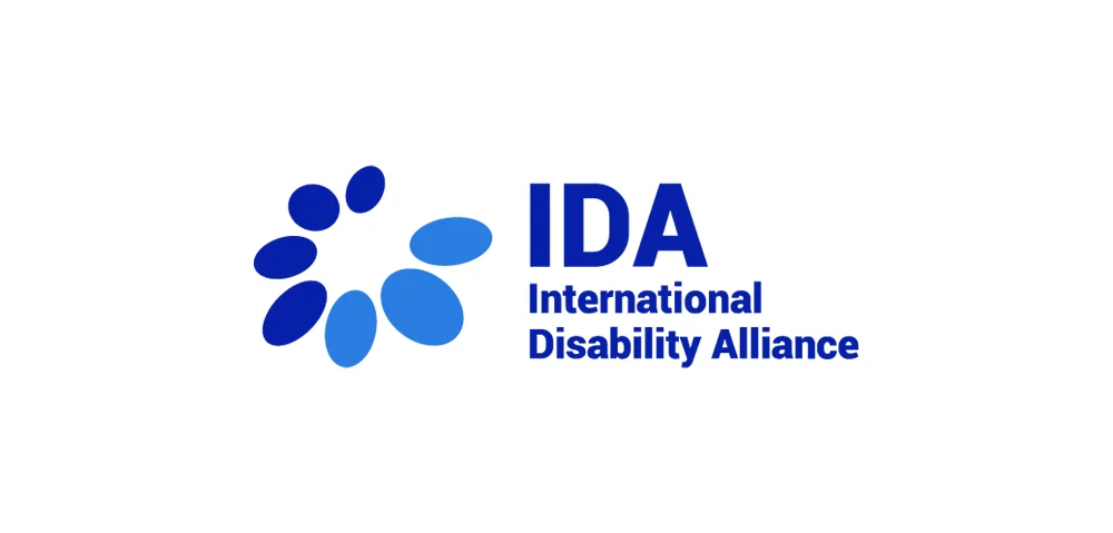 The blue logo and symbol of IDA, International Disability Alliance.