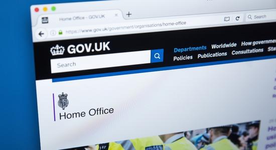The official webpage of the UK Home Office on a laptop screen.